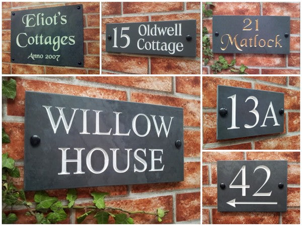 Slate house sign with deeply engraved house number on natural grey slate